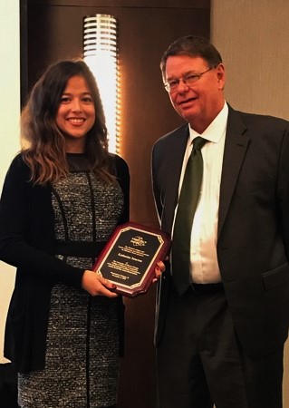 Katherine Sencion receives the 2016 Rowe Award from UIC Dean Jerry Bauman at the District IV Annual Meeting